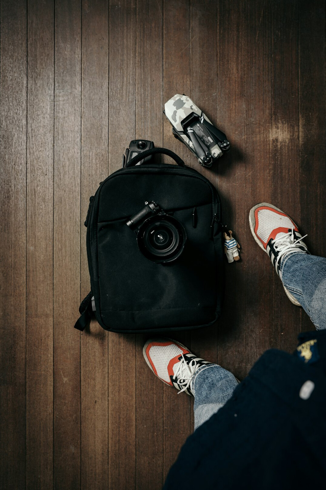 Travel flat lay with map, camera and backpack