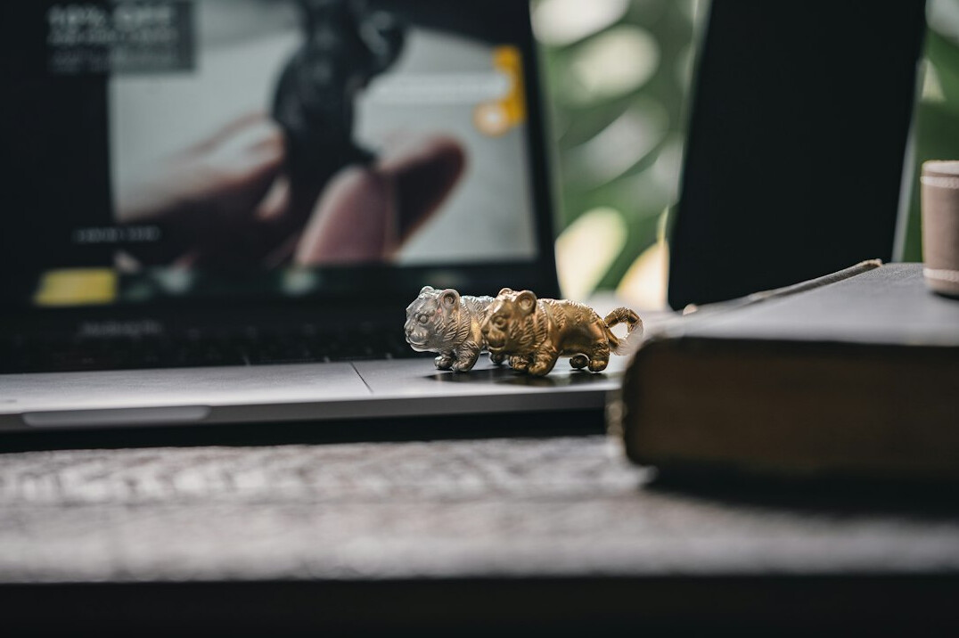 Laptop on a desk with photo editing